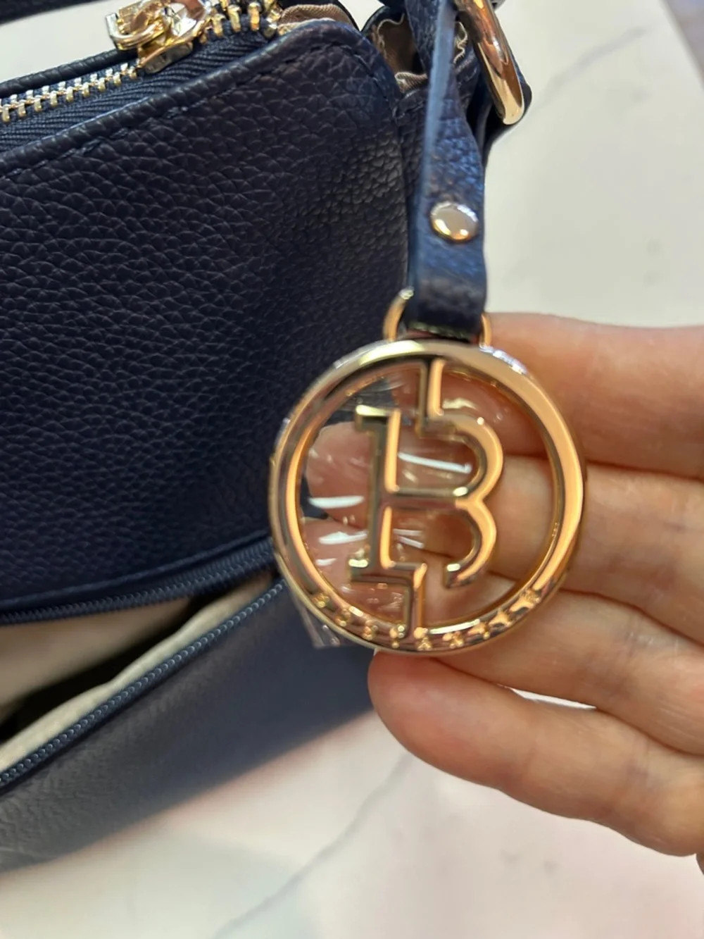 Bostanten Pebbled Navy Shoulder Bag with Gold Charm